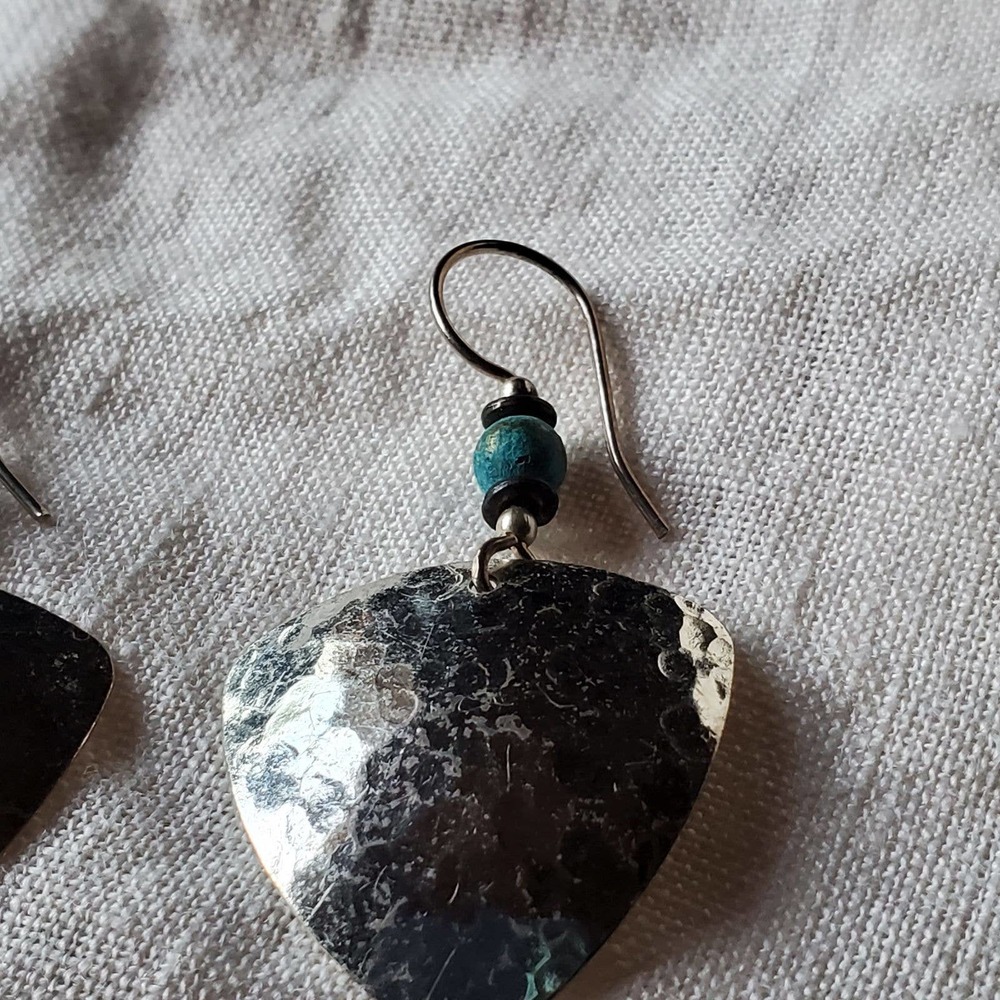 Silver toned earrings with bead